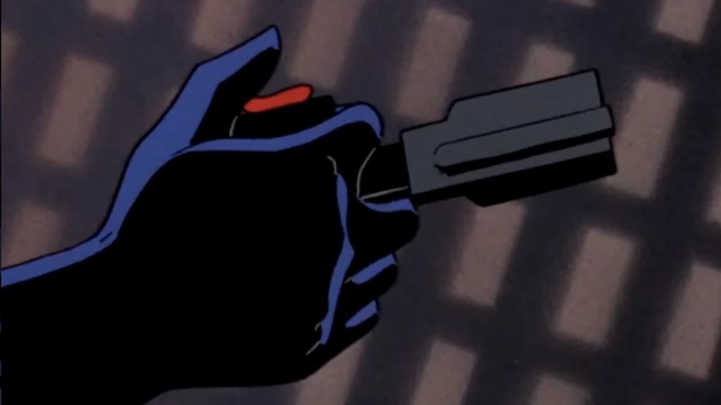 Batman firing his Grapple Gun